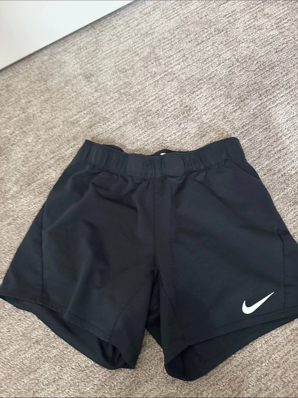 Nike Black Women's Athletic Shorts with White Swoosh and Branded Waistband